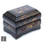 A Japanese Meiji Period (1868-1912) black lacquered jewellery casket, the hinged cover revealing