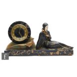 A 20th Century French Art Deco mantle clock, the black and variegated marble with a circular