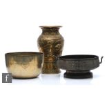 A collection of Asian metalwares, to include a Chinese Archaic style censer, the pedestal vessel