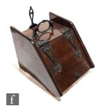 An Edwardian mahogany Art Nouveau style coal scuttle and shovel, width 35cm.