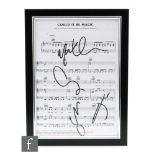 A Take That song sheet, signed Gary Barlow, Howard Donald and Mark Owen, in black marker pen,