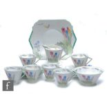 A 1930s Art Deco Shelley Eve shape part teaset decorated in the Crocus pattern, comprising six cups,