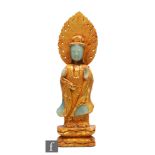 A Chinese green-hardstone and gilt figure of Guanyin, modelled in standing position with hands