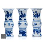 A garniture of Chinese Kangxi style blue and white beaker vases (gu), each similarly decorated