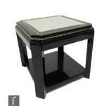 A 20th Century ebonised octagonal occasional table with bevelled glass inset top, on square legs