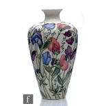 A Moorcroft Pottery vase of high shouldered form decorated in the Sweetness pattern designed by