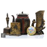 A collection of Asian metalwares, to include a temple bell, a ritual wine vessel, a Qianlong style