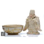 A Japanese Satsuma pottery figure of Ba Xian a Daoist immortal figure, Meiji Period (1868-1912),