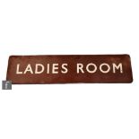 A railway Ladies Room sign, white lettering on brown background, 31cm x 121cm.