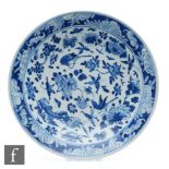 A Chinese blue and white dish, Qianlong seal mark but 19th Century, of circular form, the central