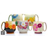 Five assorted 1930s/1940s Grays Pottery Paris jugs each decorated with a floral pattern, printed