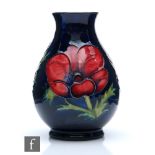 A Moorcroft Pottery baluster vase decorated in the Anemone pattern, impressed mark, height 13.5cm.