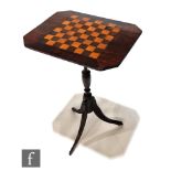 A Victorian occasional games table, the chequer board top over a turned pedestal and splayed