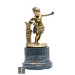 A 19th Century gilt metal figure of a putti wearing a bag and a sash with outstretched hand near a