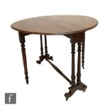 A Victorian mahogany oval drop flap Sutherland table on turned legs united by a turned stretcher,