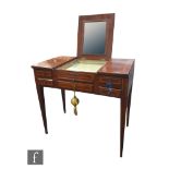 An Edwardian satinwood crossbanded plum pudding mahogany ladies dressing table, the triple hinged