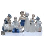 Three Royal Copenhagen figures comprising an Amager Girl Knitting modelled by Lotte Benter, a