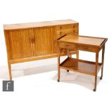 A Cotswold School style oak sideboard, designed and made by M.L. Richardson, fitted with an