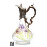 A late 19th Century French claret jug, the low shouldered body hand enamelled with flag iris over