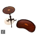 An Edwardian inlaid kidney shaped gallery two handled serving tray with shell paterae centre,