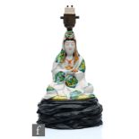 A Japanese Meiji Period (1868-1912) figure of Kannon, the bodhisattva dressed in robe and modelled