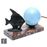 A small 1930s Art Deco lamp, the rectangular marble base with a metal fish beside a blue glass