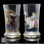 A pair of 19th Century clear crystal drinking glasses of footed cylindrical form, each decorated