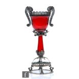 A 19th Century Italian Venetian ruby glass chalice with an ovoid bowl and hollow blown stem, mounted