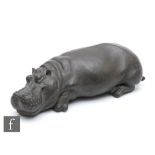 A contemporary cold cast bronze study of a sleeping hippo, by Rosalie Johnson, numbered 29 from a
