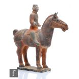 A Chinese Tang Dynasty style pottery figure of a Terracotta army warrior, the rider astride a horse,