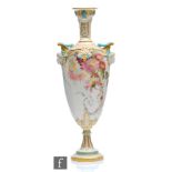 A large Royal Worcester shape 1410 pedestal vase decorated with enamel flowers and garlands with