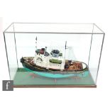 A contemporary scale model of a tug boat named Hilary J. Dunn, modelled on the Tyne tug Ryhope,