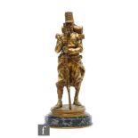 A gilt bronze figure of a standing French soldier holding a rifle, after Emmanuel Fremiet, signed E.