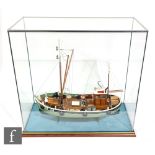 A contemporary scale model of a fishing boat, named Puffin, BM 54, displayed in a glazed panel case,