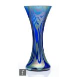 A contemporary Okra studio glass vase of waisted sleeve form, the blue ground with trails of