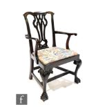 A Chippendale style mahogany elbow chair, pierced vase splat, slip in seat on cabriole legs with