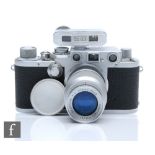 A 1951-52 Leica IIIF, the chrome body with serial No. 595191, fitted with Elmar 90mm 1:4 lens,