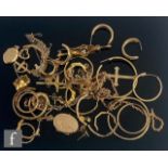 A parcel lot of assorted 9ct items to include earrings, lockets, crosses and chains etc, total