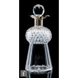 A late 19th Century clear crystal glass decanter of thistle form with slice and mitre cut body below