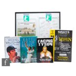 A signed copy of Facing Tyson by Mike Tyson, another signed by Michael Vaughan, a signed copy of the