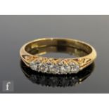 A late 19th Century 18ct diamond five stone boat shaped ring, graduated claw set, old cut stones,