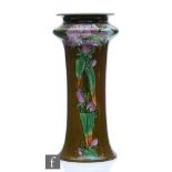 An early 20th Century Doulton Lambeth vase, decorated by Margaret Thompson with panels of purple