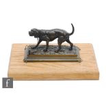 A late 19th Century bronze study of a blood hound on stepped base and later oak plinth, width 19cm.