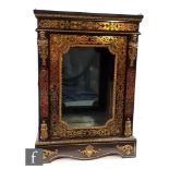 A late 19th Century Louis XV1 style ebonised boulle work pier cabinet, enclosed by a glazed door