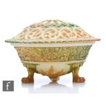 A Royal Worcester shape G846 pomander, the bowl raised to three paw feet, with a band of moulded