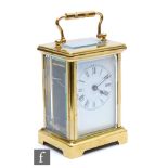 A late 19th to early 20th Century French brass carriage clock, white enamelled dial, on plinth base,