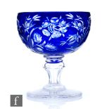 An early 20th Century Stevens & Williams crystal glass pedestal bowl, the bowl cased in royal blue