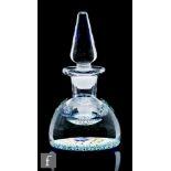 A 20th Century crystal glass ink well with a concentric millefiori base and spire form stopper