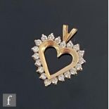 A 14ct diamond set heart shaped pendant with a twenty stone claw set diamond and gold border to a