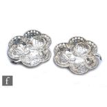 A pair of hallmarked silver bon bon dishes each modelled as a clover leaf with pierced decoration,